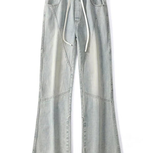 Black Luxenk© drawstring wide-leg jeans by Trendsi, featuring a relaxed fit and casual style, shown on a model.