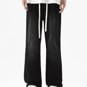 Black Luxenk© Drawstring Wide Leg Jeans by Trendsi featuring relaxed fit and casual style, shown on a mannequin.