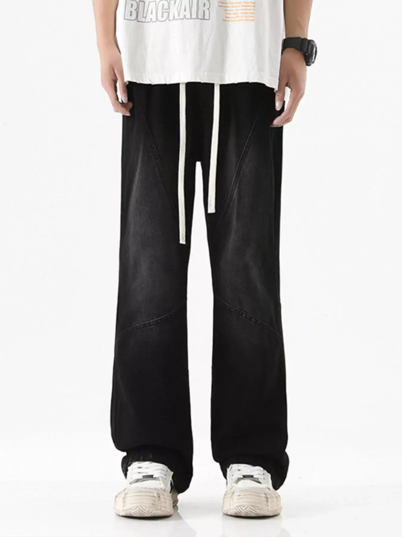 Black Luxenk© Drawstring Wide Leg Jeans by Trendsi featuring relaxed fit and casual style, shown on a mannequin.