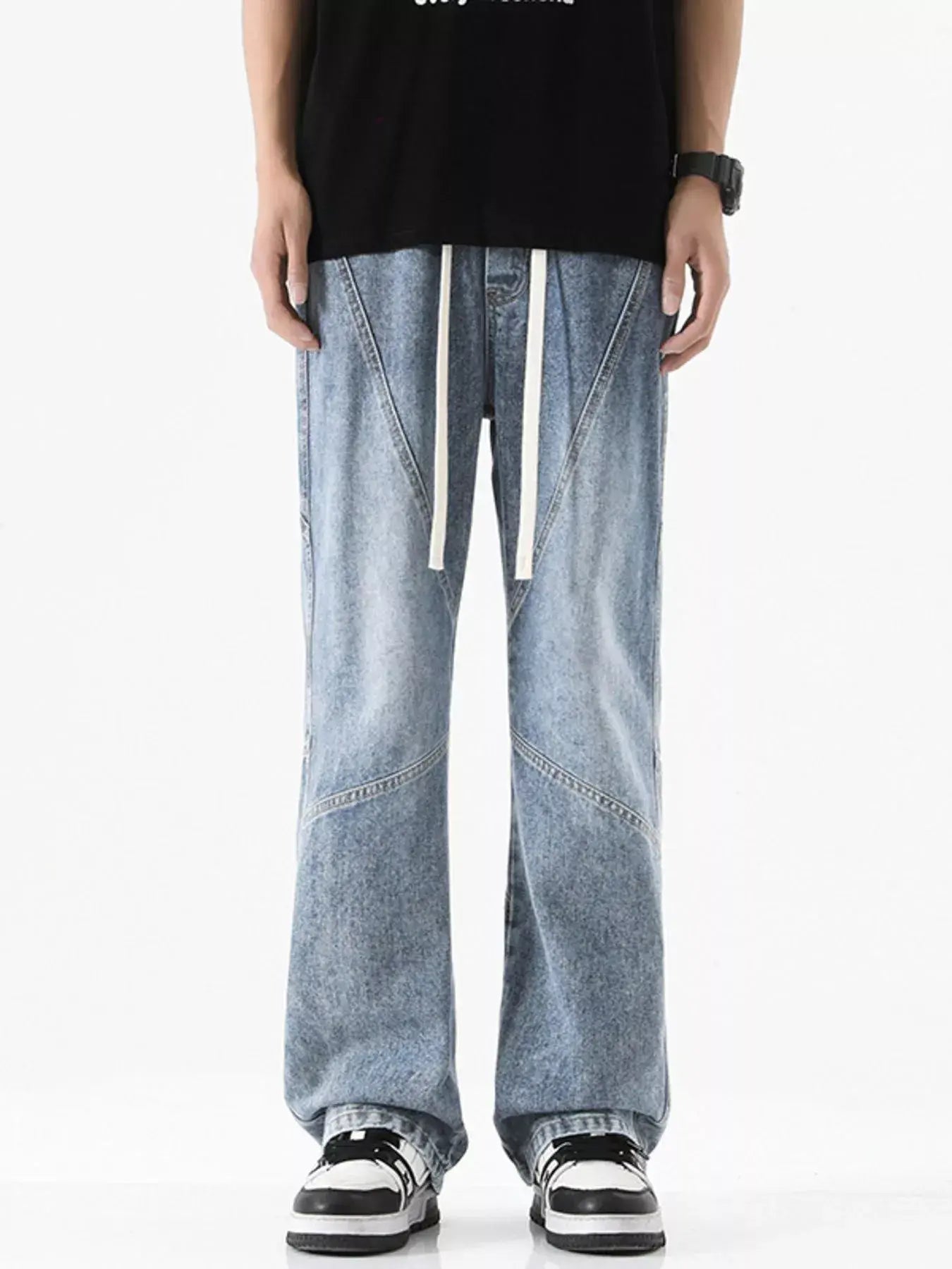 Black Luxenk© drawstring wide-leg jeans from Trendsi, featuring a relaxed fit and casual style, shown on a model.