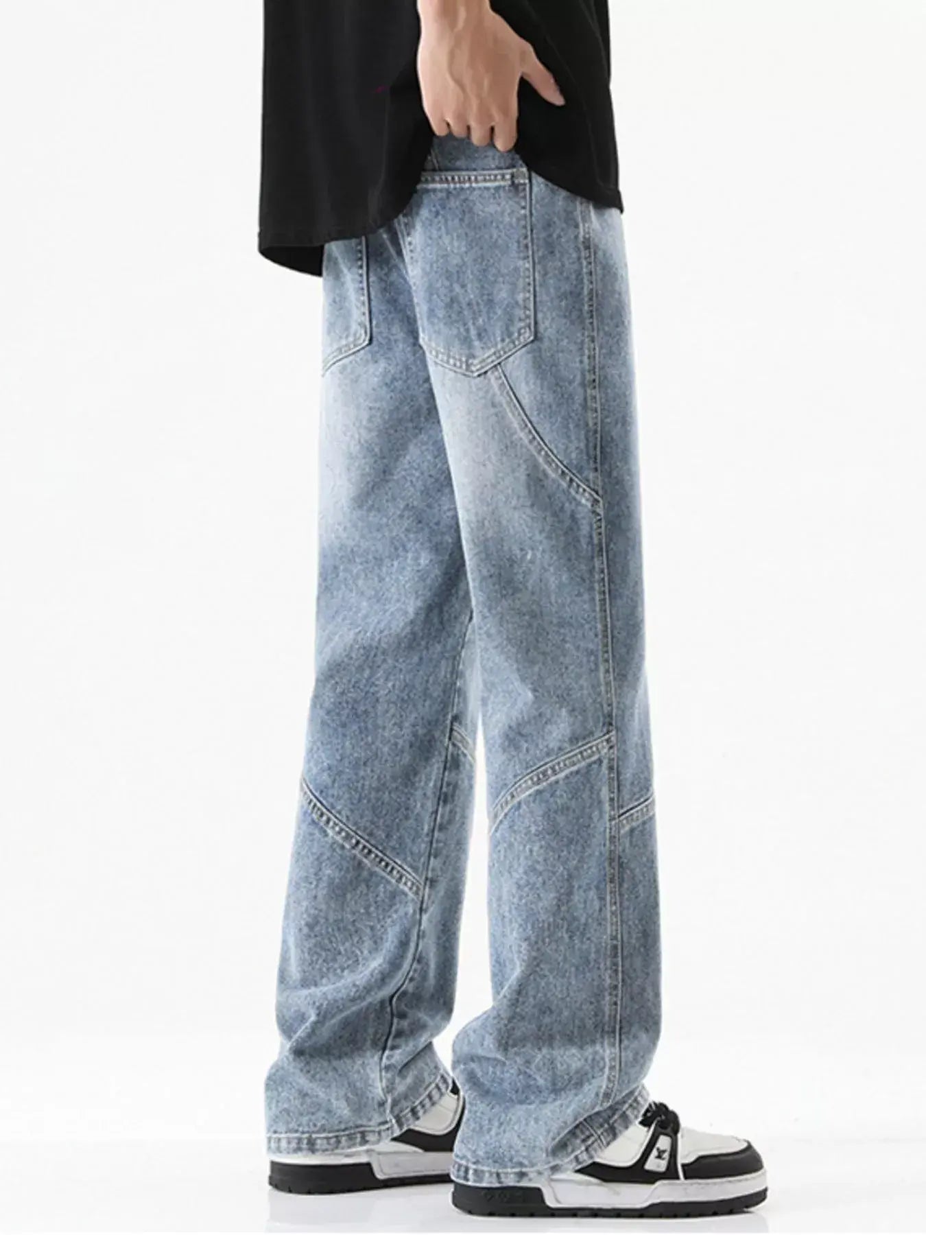 Black Luxenk drawstring wide-leg jeans by Trendsi, shown with a relaxed fit and adjustable waistband, on a model.