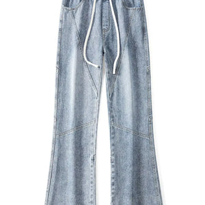 Black Luxenk Drawstring Wide Leg Jeans from Trendsi, featuring a relaxed fit with a drawstring waistband and wide leg style.