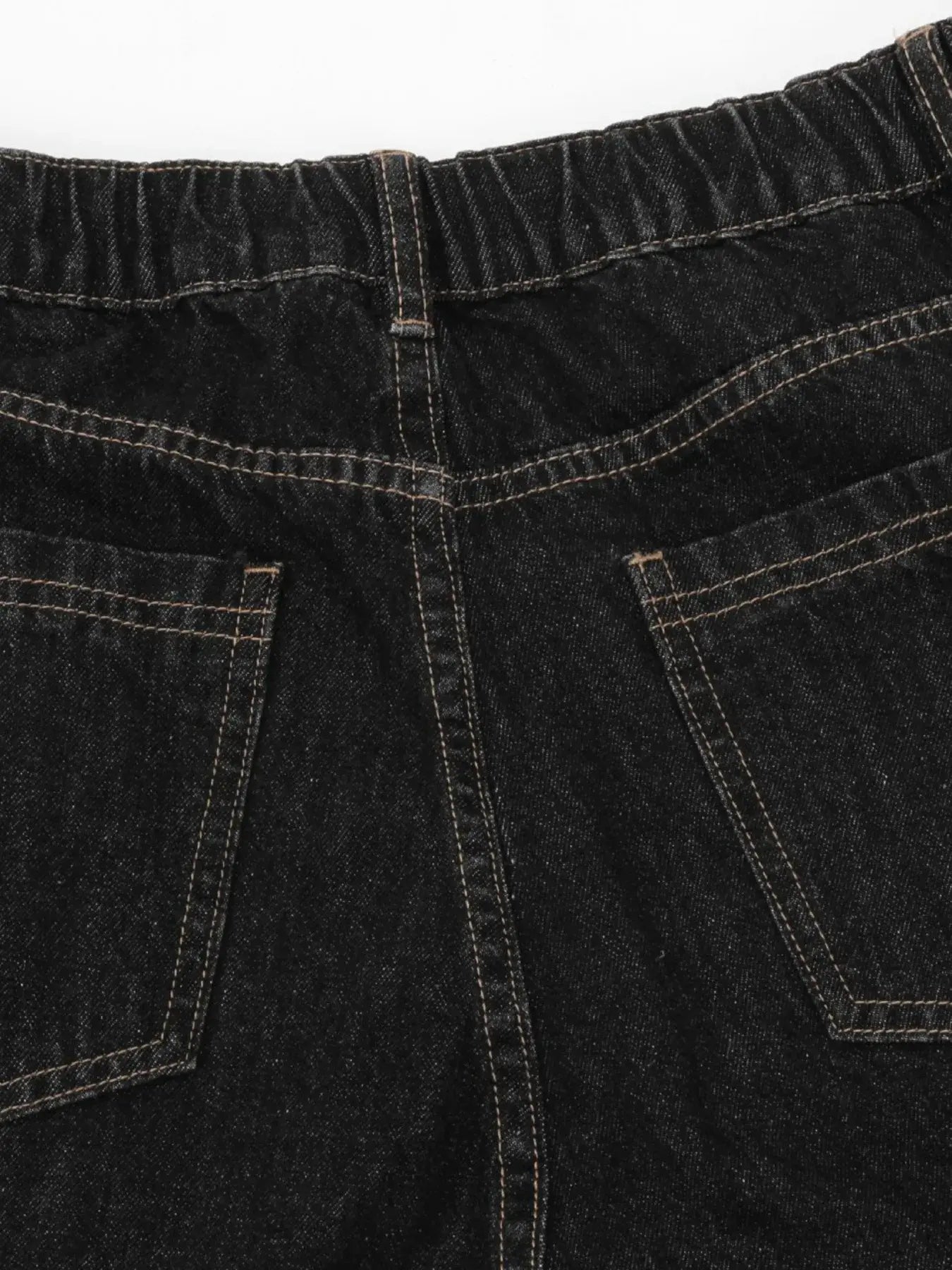 Black denim shorts with plaid accent details from LUXENK© "Plaid Accent Denim" collection by Trendsi, featuring a casual fit.