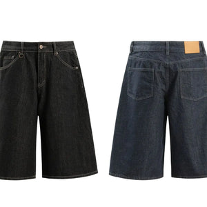 Black Luxenk© pocketed loose denim shorts by Trendsi, showing relaxed fit with side pockets and casual style.