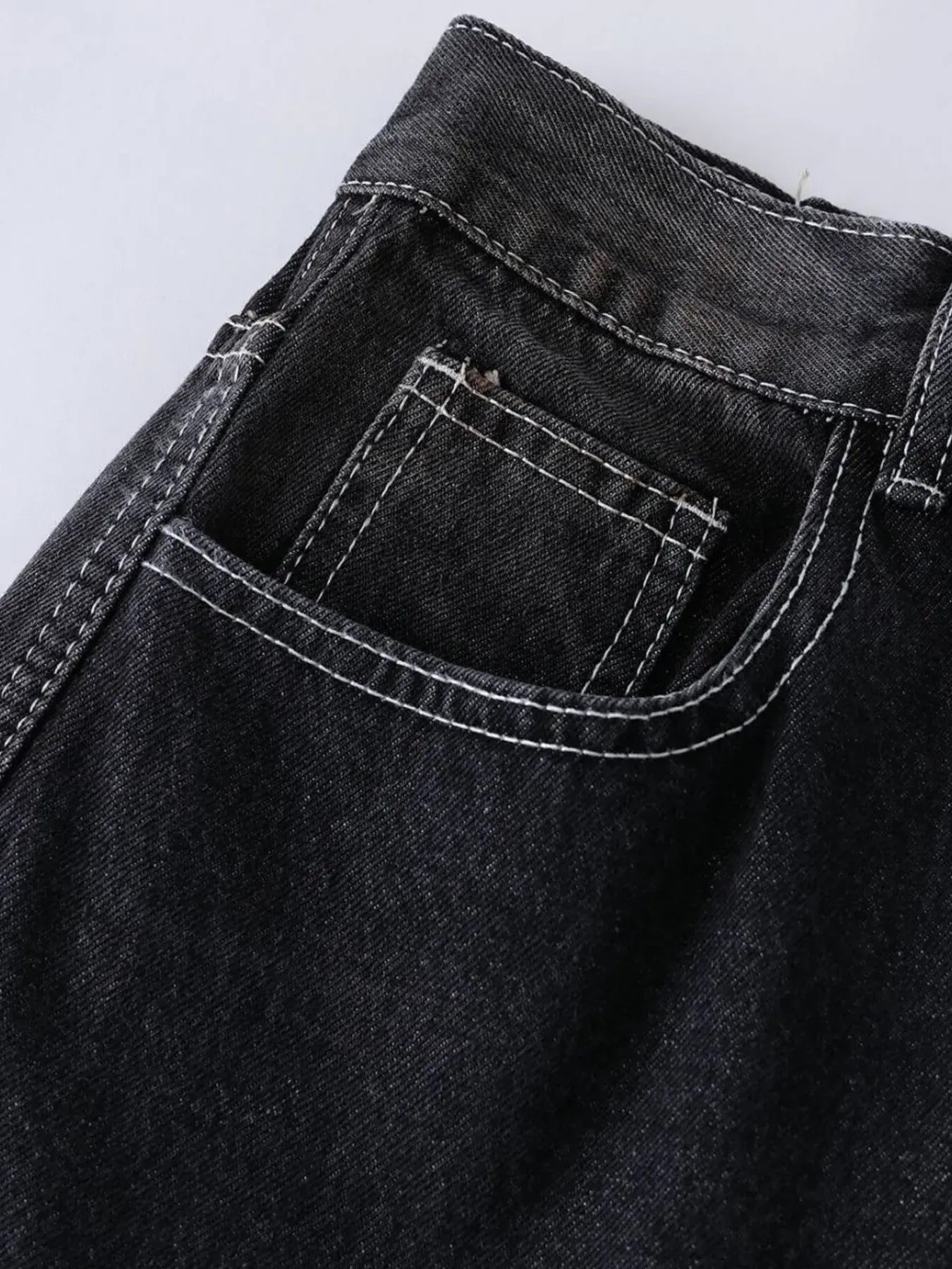 Black LUXENK Vintage Wide Leg Jeans by Trendsi, featuring a relaxed fit and classic denim style, shown on a model.