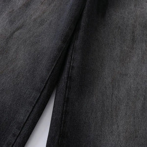 Black Luxenk Vintage Wide Leg Jeans by Trendsi featuring a relaxed fit, high waist, and classic denim style.