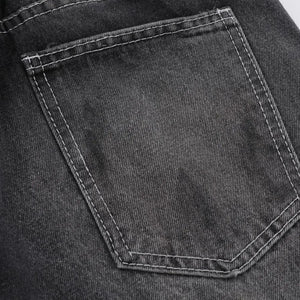 Black Luxenk Vintage Wide Leg Jeans by Trendsi, showcasing relaxed fit and high-rise style with distressed detailing.