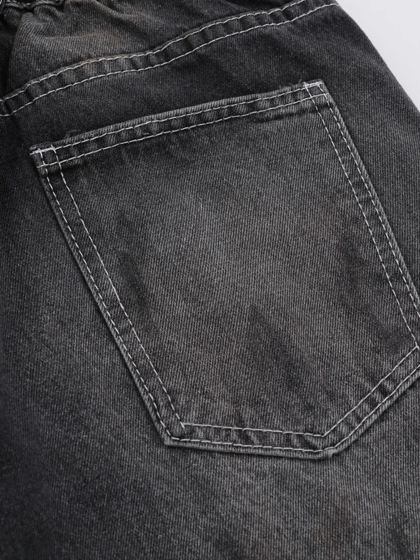 Black Luxenk Vintage Wide Leg Jeans by Trendsi, showcasing relaxed fit and high-rise style with distressed detailing.