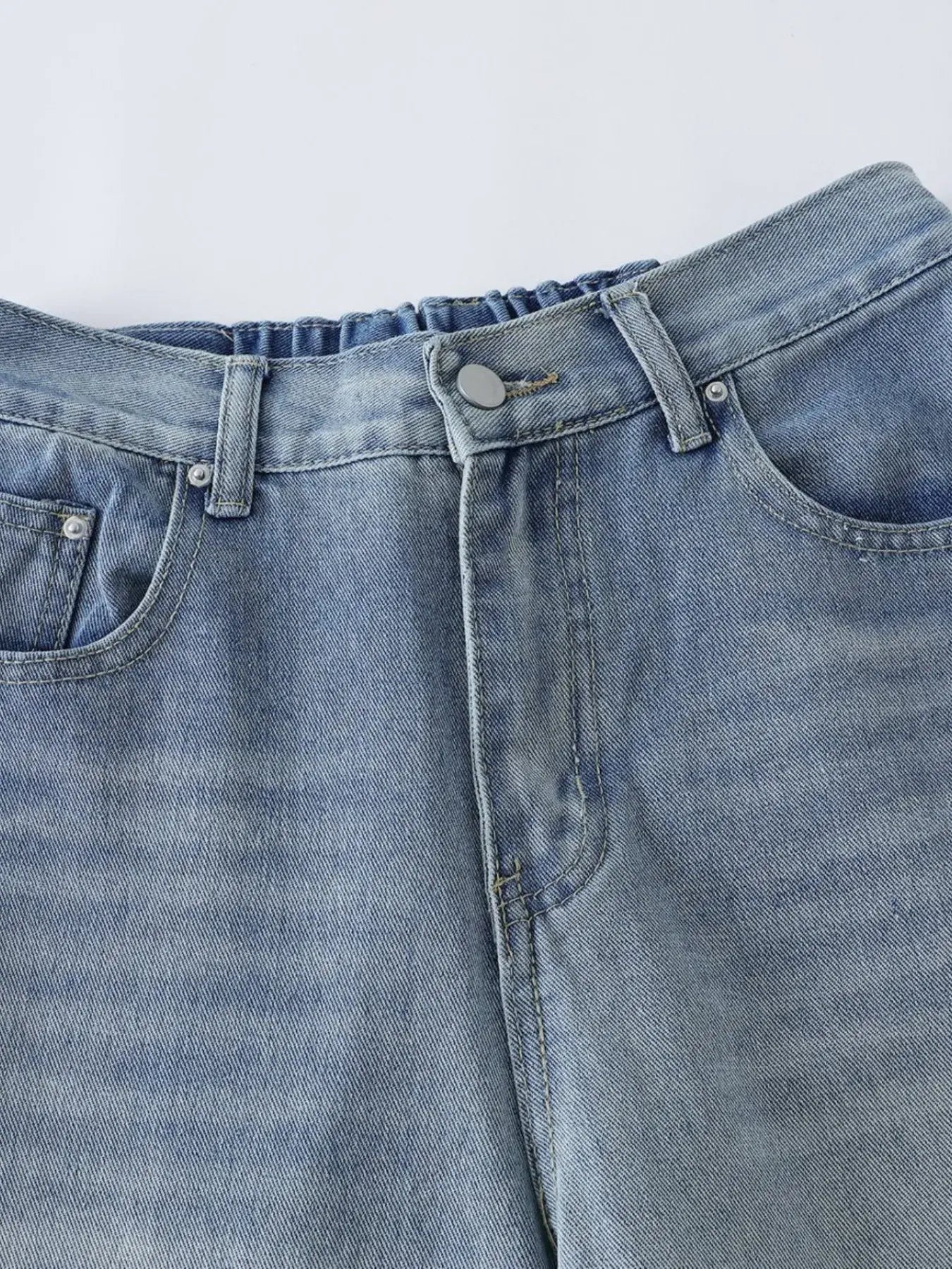 Blue Luxenk High Waist Wide Leg Jeans by Trendsi, showcasing a relaxed fit and stylish wide-leg design on a model.
