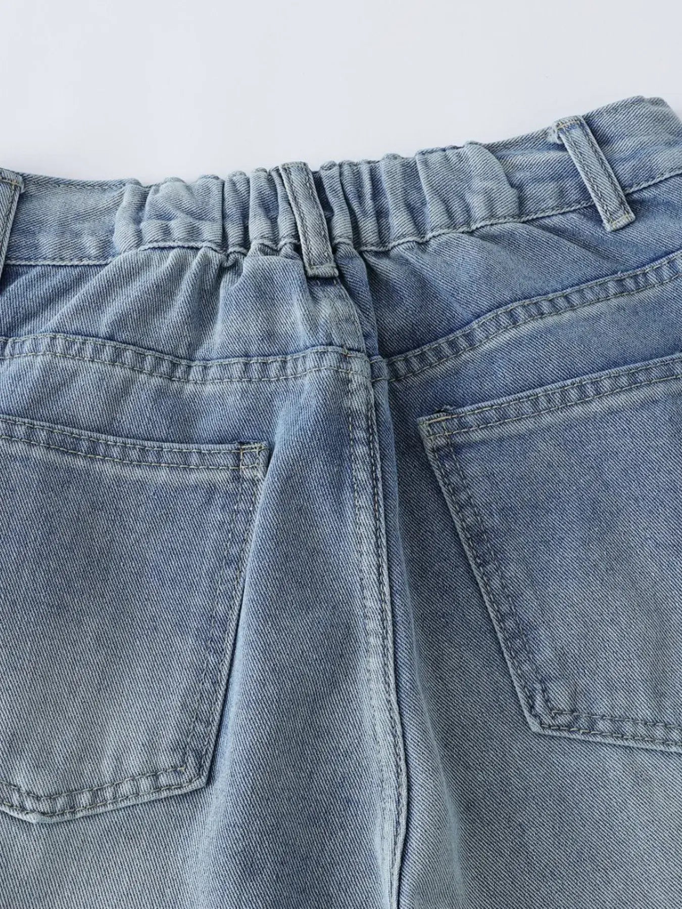 Blue Luxenk High Waist Wide Leg Jeans by Trendsi, showing the relaxed fit and wide-leg design on a model.