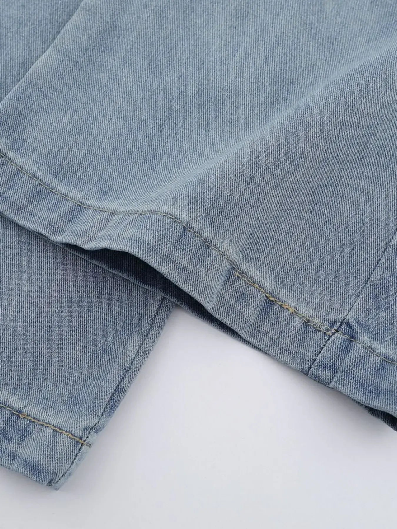 Blue high waist wide leg jeans by Luxenk from Trendsi, showing the relaxed fit and stylish design on a mannequin.