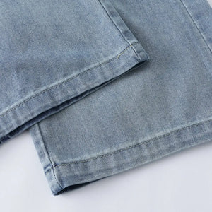 Blue Luxenk High Waist Wide Leg Jeans by Trendsi, showing the relaxed fit and stylish design with a high waist silhouette.