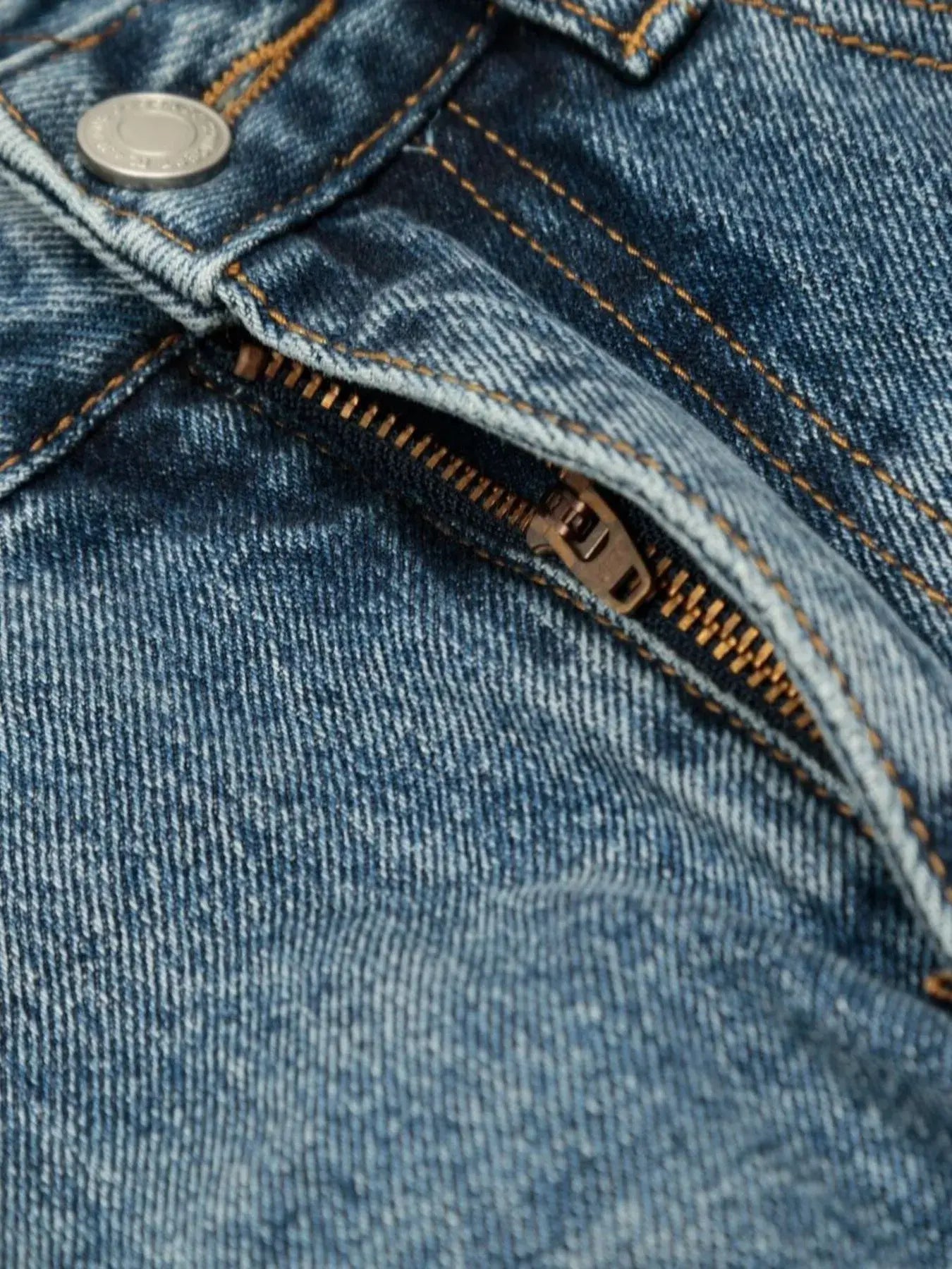 Blue washed denim shorts from Luxenk© by Trendsi, featuring a casual fit and rolled hem, perfect for summer wear.