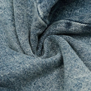 Blue washed denim shorts by Luxenk© featuring a classic short style, displayed on a model with casual styling.