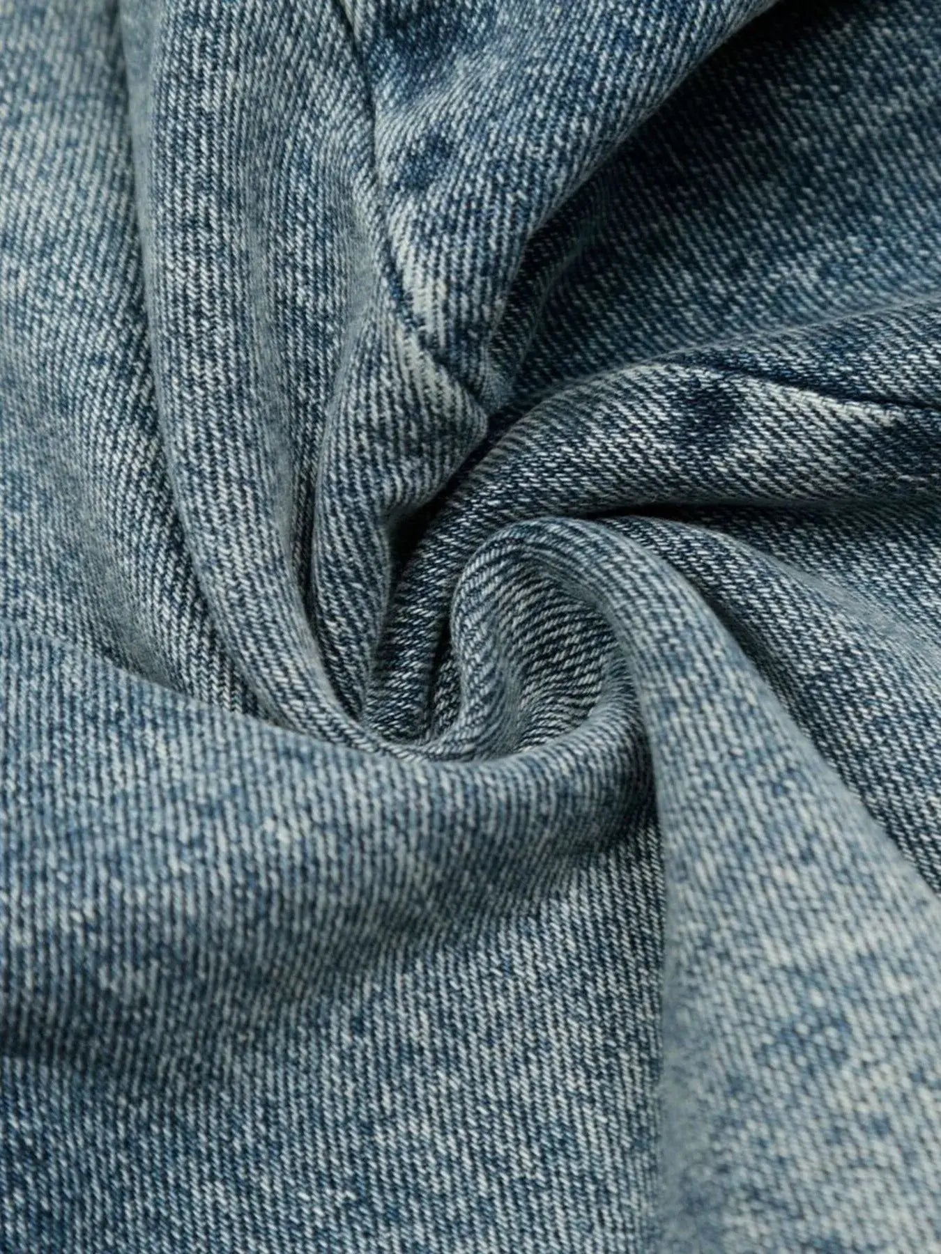 Blue washed denim shorts by Luxenk© featuring a classic short style, displayed on a model with casual styling.