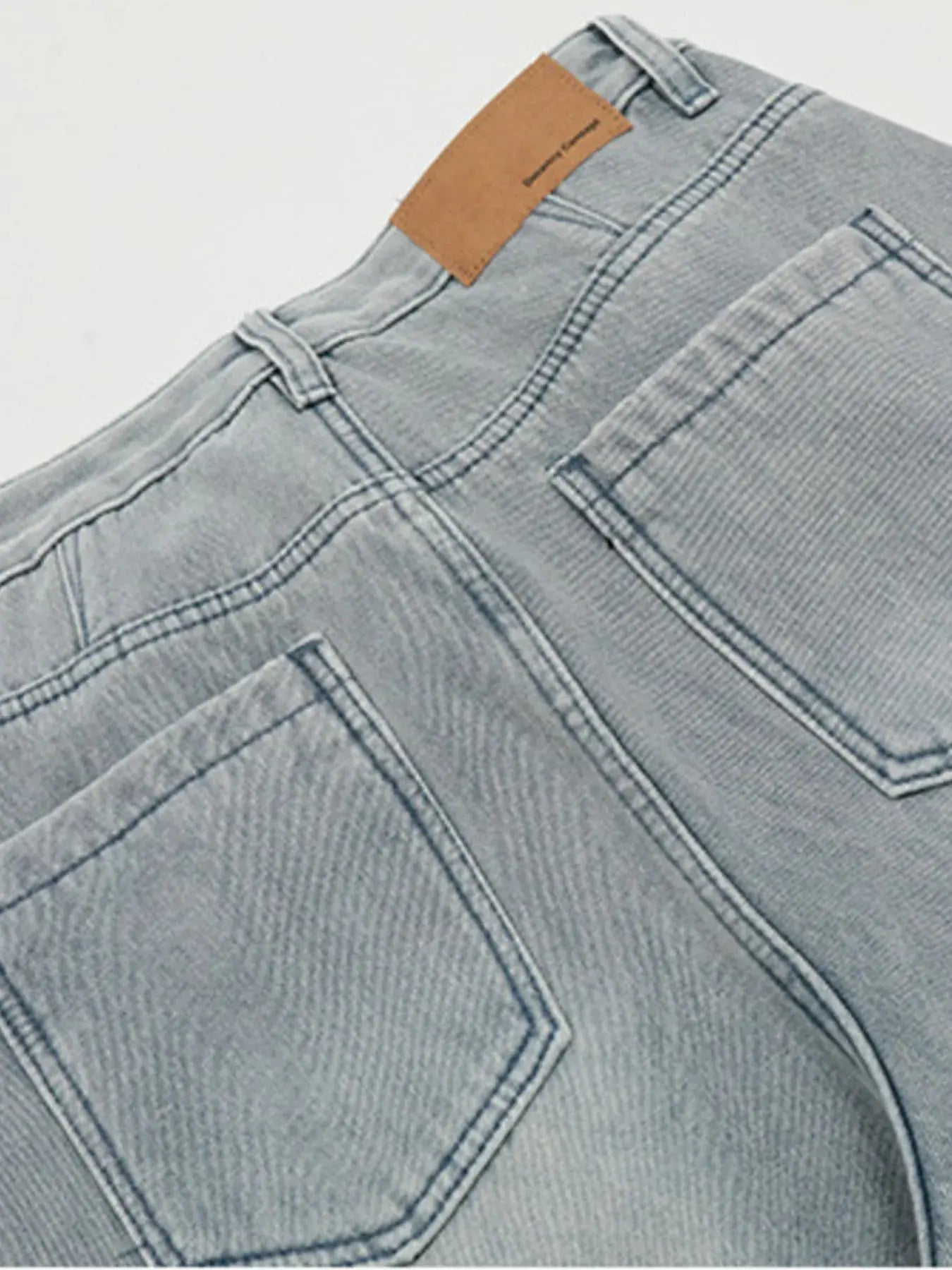 Blue LUXENK© Wide Leg Jeans by Trendsi, showing a relaxed fit with a high waist and wide-leg style on a model.