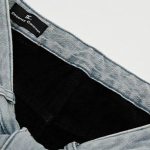 Light blue Luxenk Wide Leg Jeans by Trendsi featuring a relaxed fit and high waist, displayed on a model.