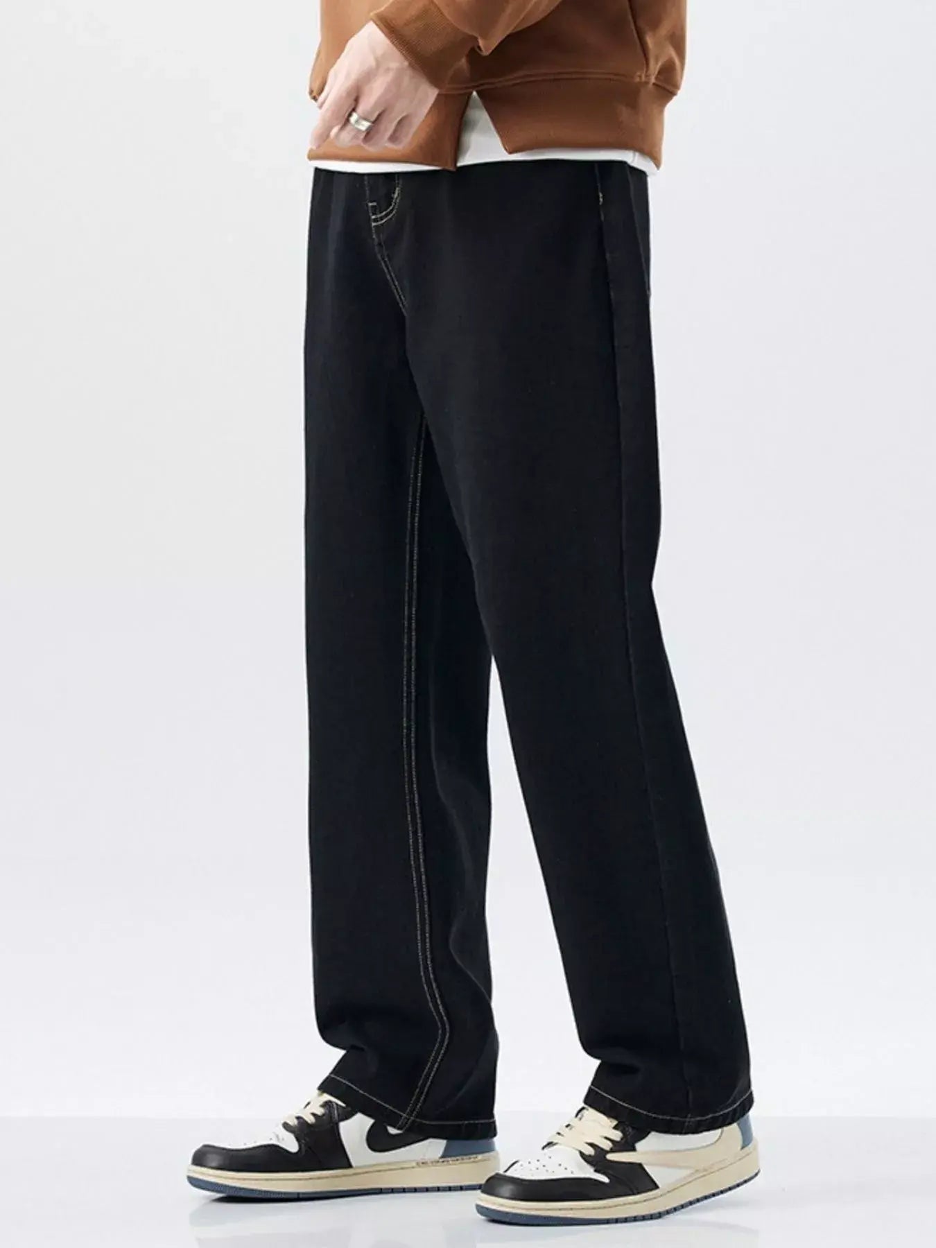 Black Luxenk Plus Wide Leg Jeans by Trendsi, showing high-waisted, relaxed fit denim with wide legs and classic design.