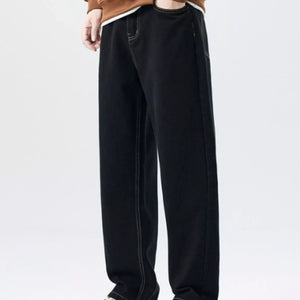 Trendsi LUXENK Plus Wide Leg Jeans in classic black, showing the relaxed fit and wide-leg design on a model.