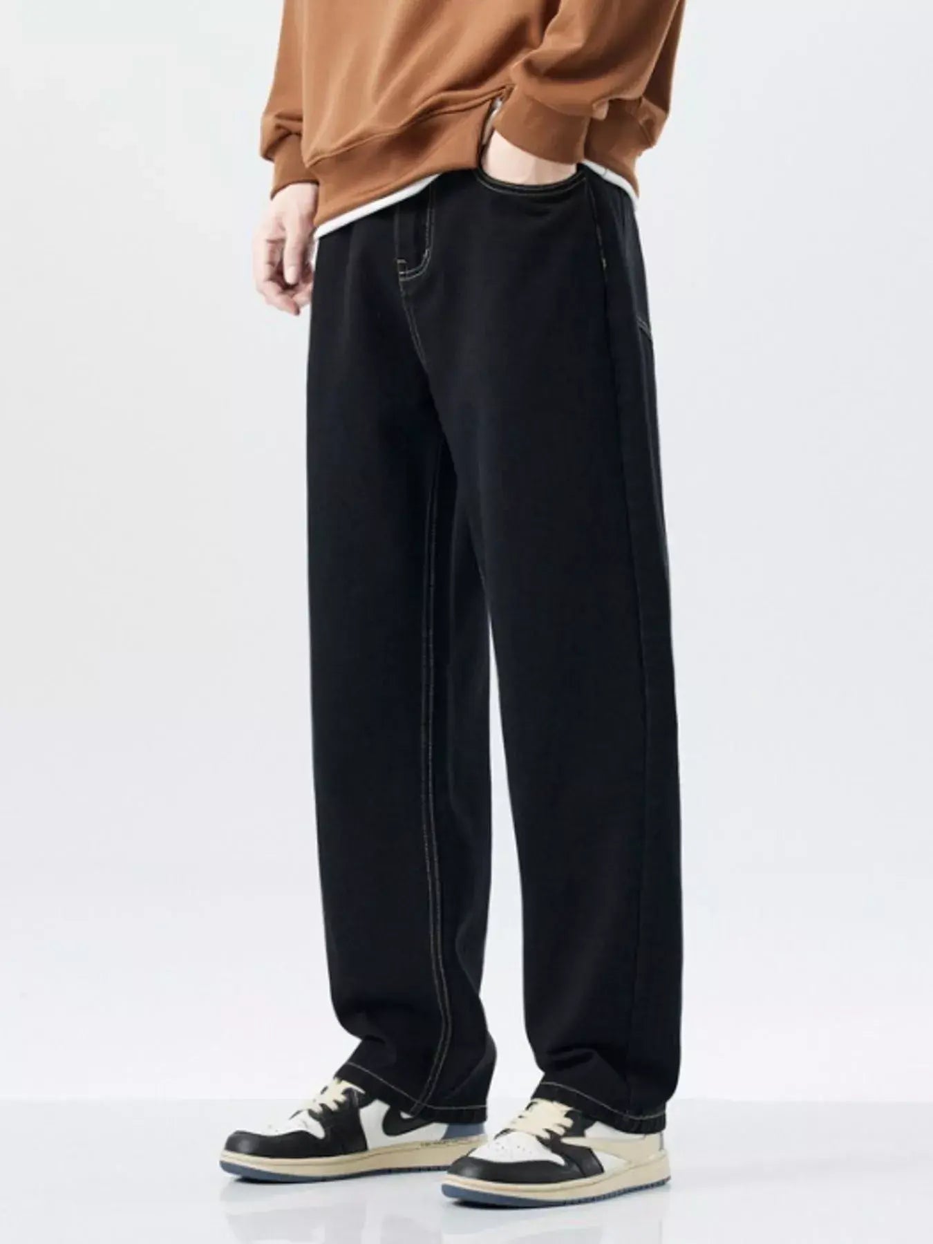 Trendsi LUXENK Plus Wide Leg Jeans in classic black, showing the relaxed fit and wide-leg design on a model.