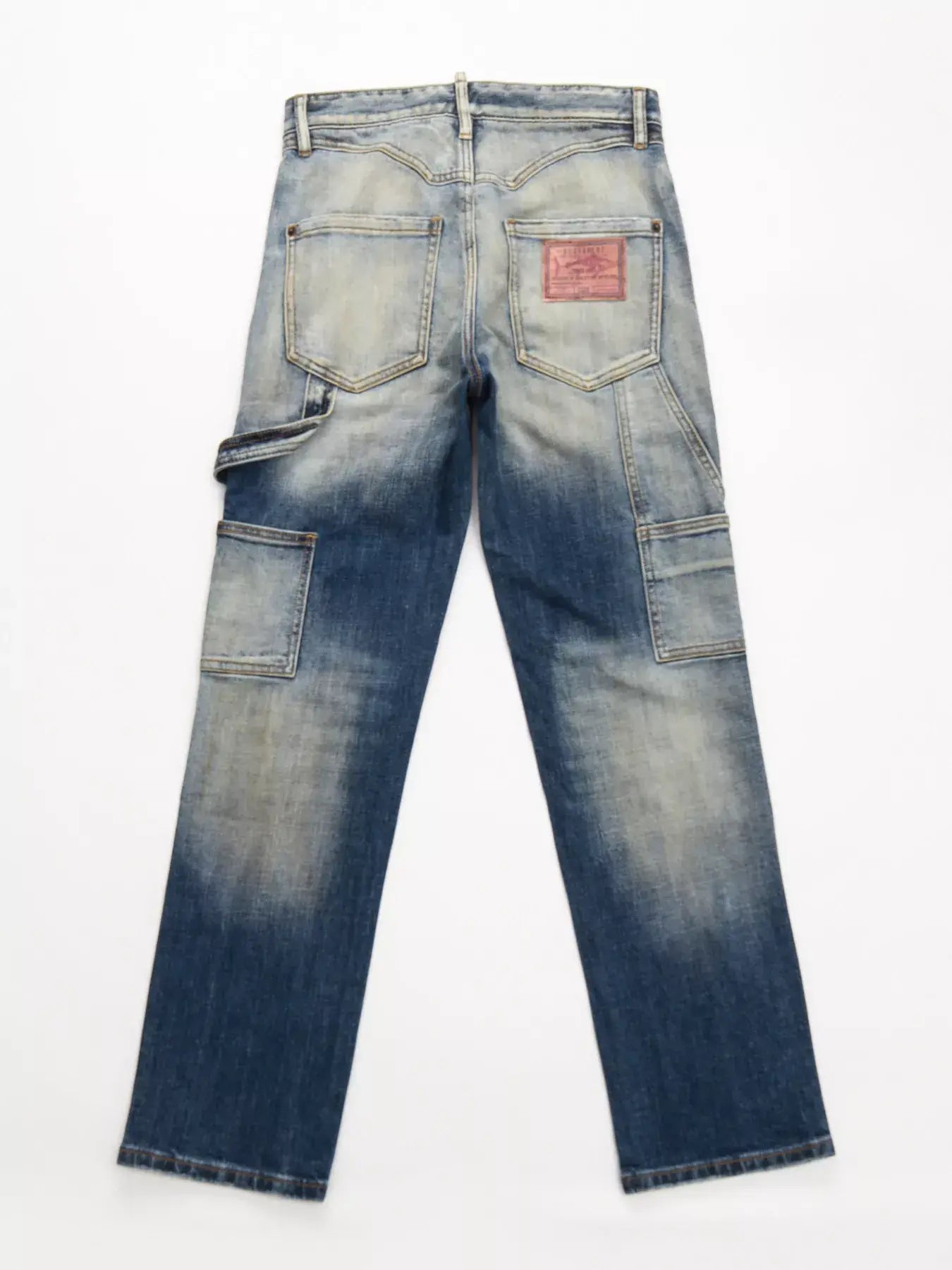 Dark distressed LUXENK© jeans by Trendsi, featuring a slim fit and rugged design, displayed on a neutral background.