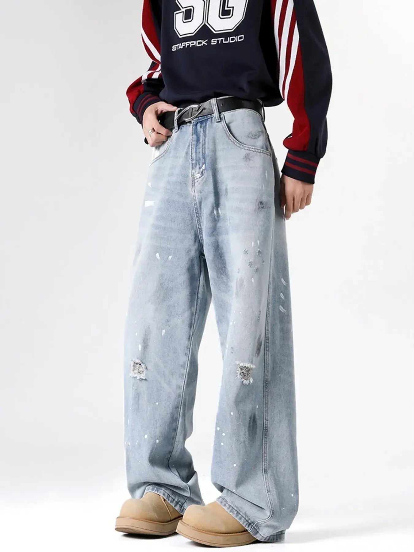Light blue Luxenk© distressed wide-leg jeans with a relaxed fit, featuring a high waist and frayed hem for a casual, trendy look.