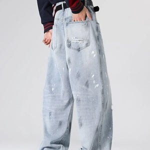 Light blue distressed wide-leg jeans by Luxenk©, featuring a relaxed fit and stylish worn-in details.