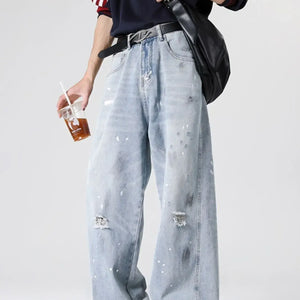 Light blue distressed wide leg jeans by Luxenk, featuring a relaxed fit and trendy worn-in look.