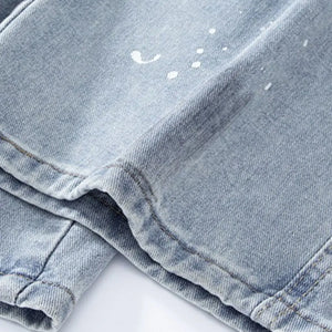 Light blue Luxenk© distressed wide-leg jeans with a relaxed fit and ruffled details, styled by Trendsi.