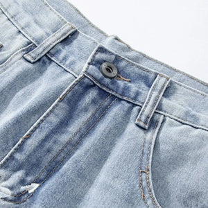 Light blue distressed wide-leg jeans by Luxenk, featuring a relaxed fit and frayed edges, styled by Trendsi.