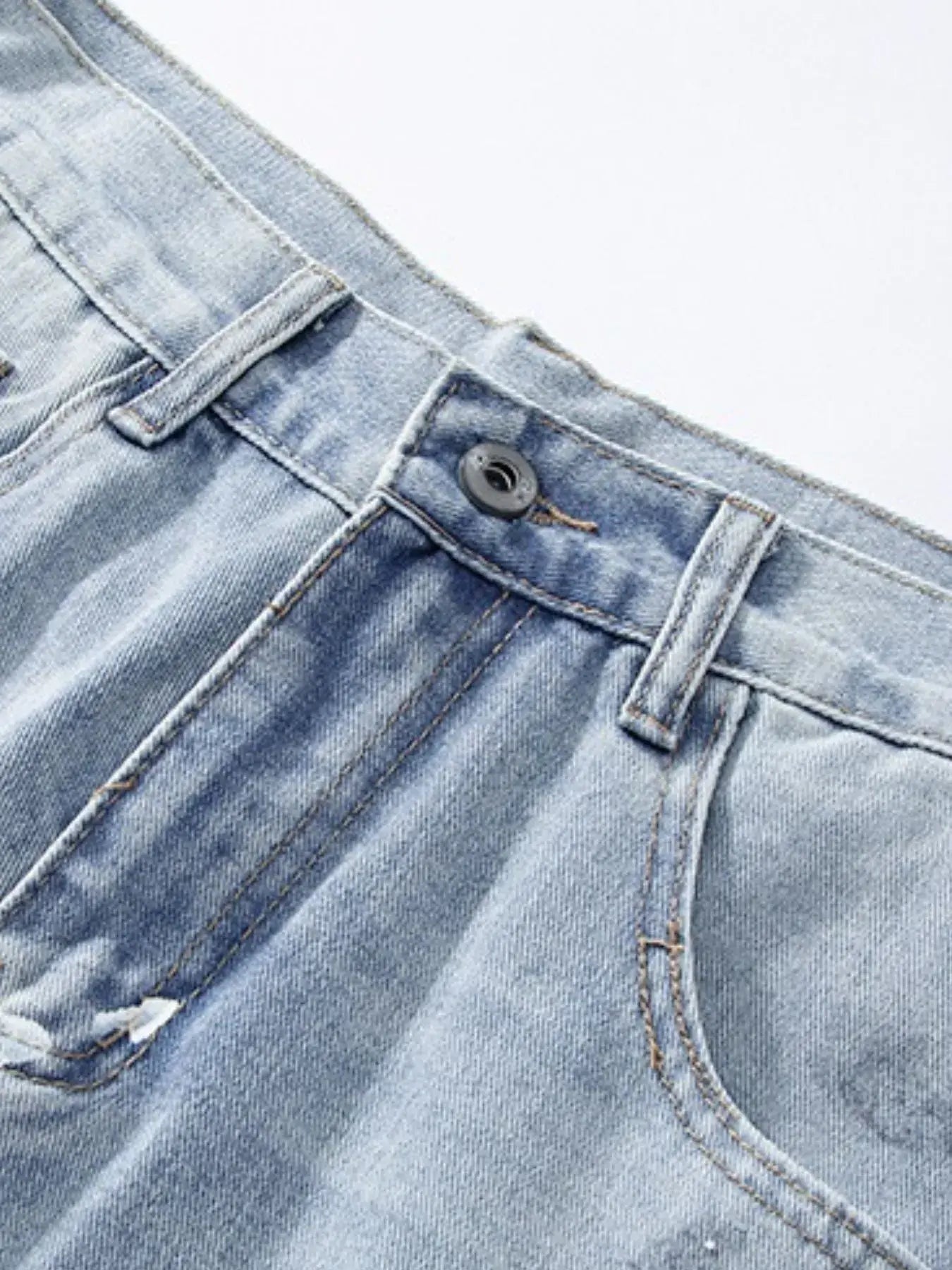 Light blue distressed wide-leg jeans by Luxenk, featuring a relaxed fit and frayed edges, styled by Trendsi.