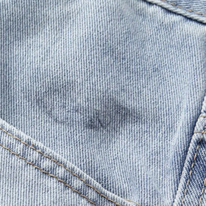 Light blue Luxenk© distressed wide-leg jeans featuring a relaxed fit and frayed details, showcased on a white background.