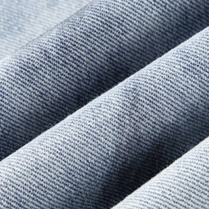 Light blue distressed wide-leg jeans by Luxenk© featuring a relaxed fit and frayed hem, perfect for casual wear.