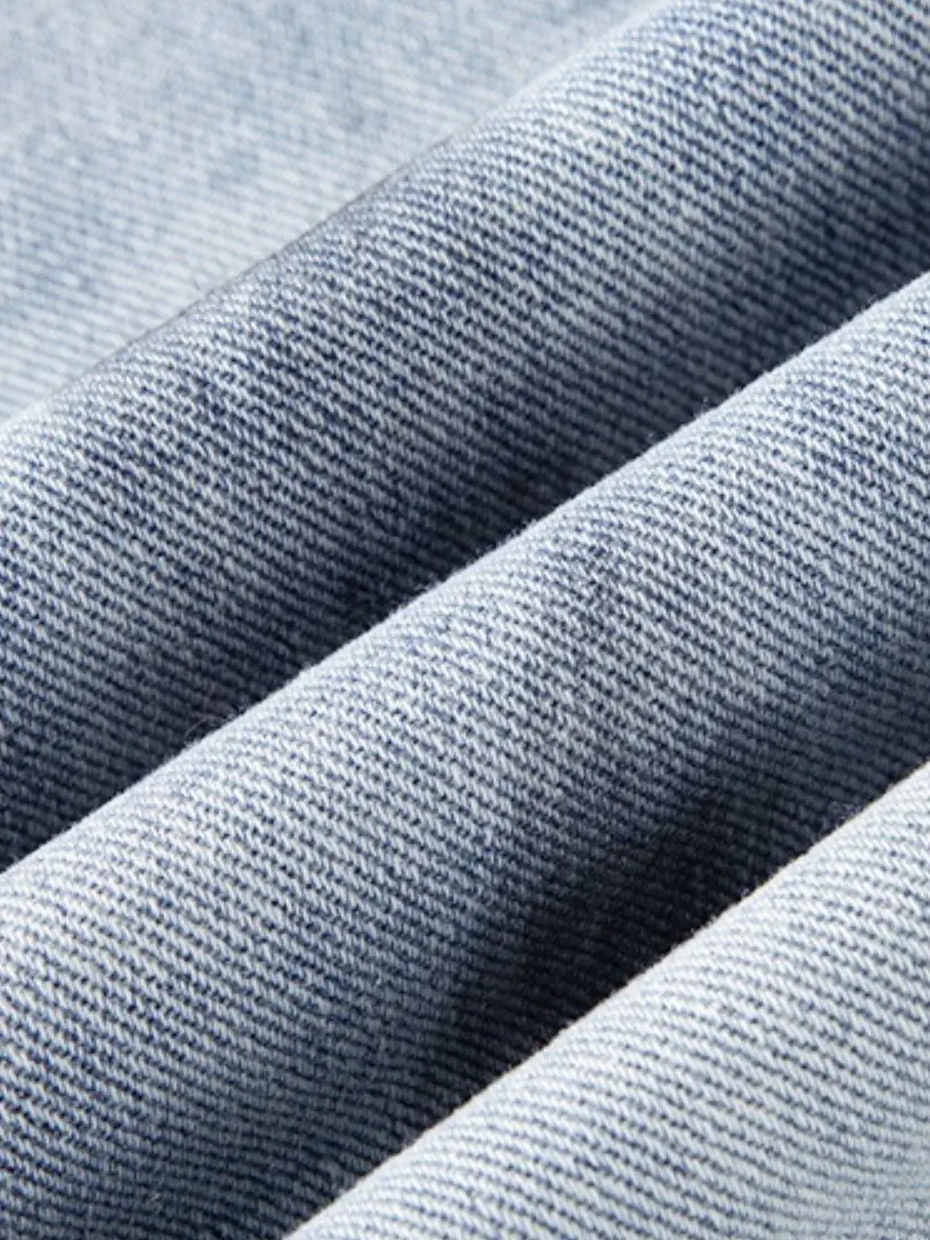 Light blue distressed wide-leg jeans by Luxenk© featuring a relaxed fit and frayed hem, perfect for casual wear.