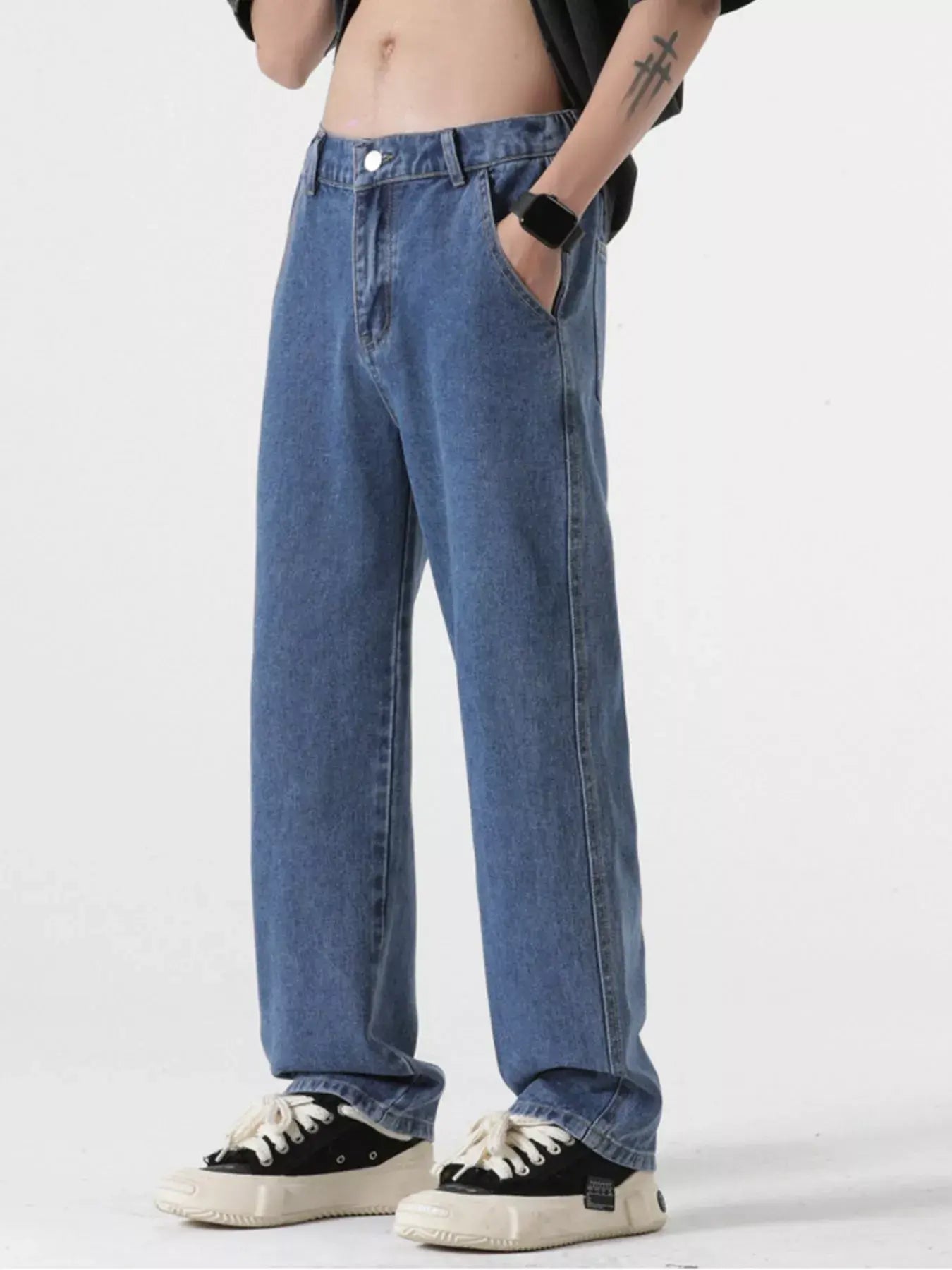 Light blue Luxenk Relaxed Fit Jeans by Trendsi, shown on a model, featuring a casual, comfortable fit and classic denim style.