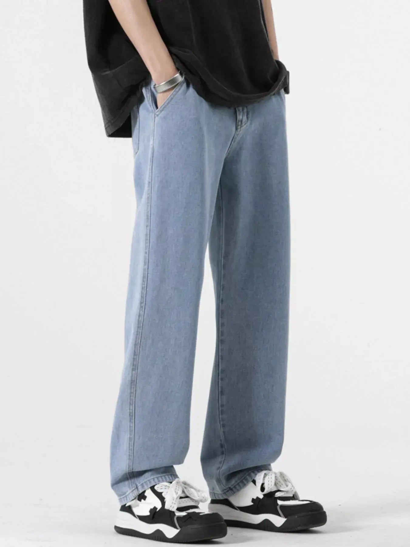 Light blue Luxenk® Relaxed Fit Jeans by Trendsi, showing a casual fit with front pockets and classic denim texture.