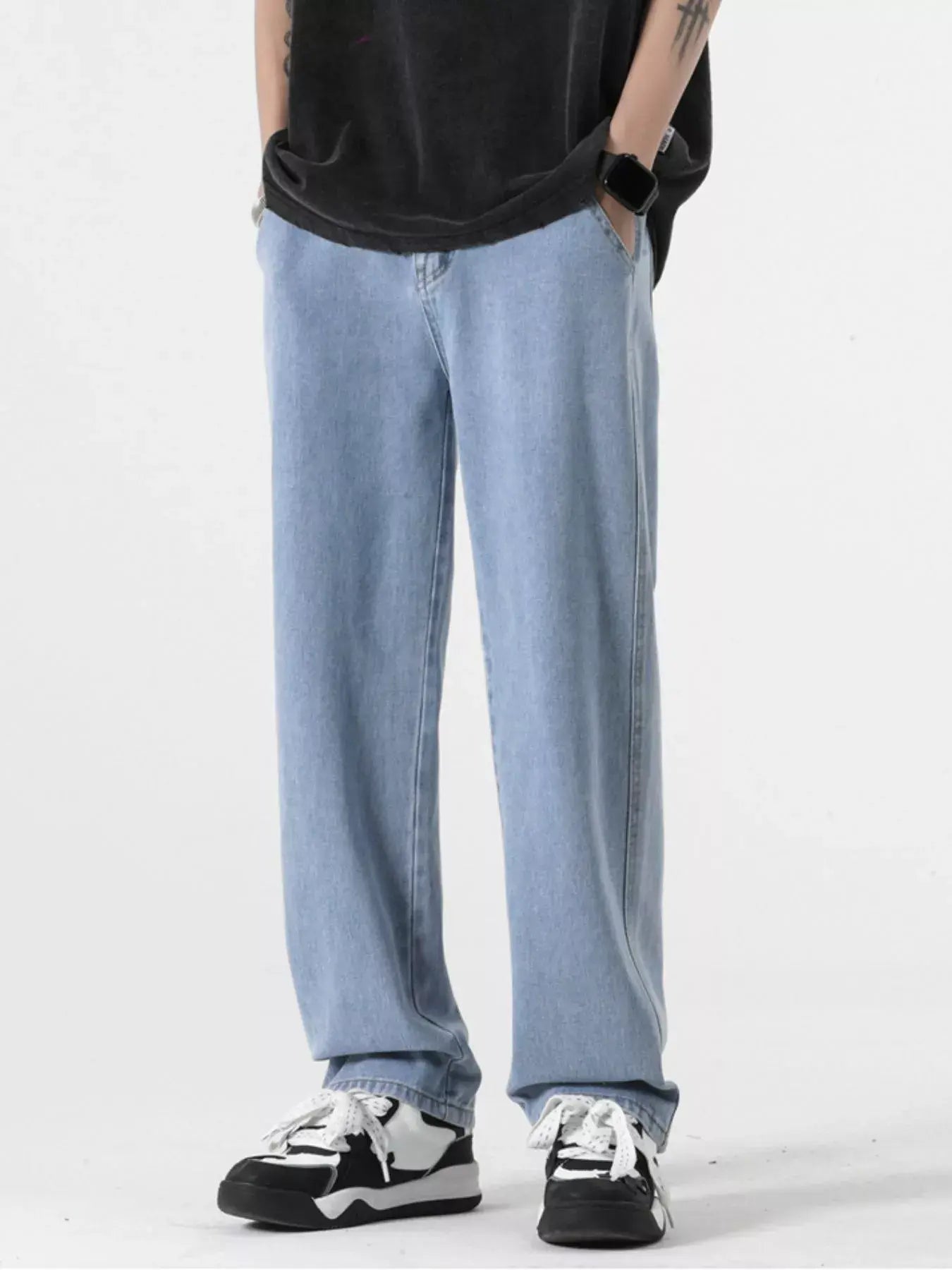 Light blue Luxenk Relaxed Fit jeans by Trendsi, showcasing a casual fit with classic denim texture and stitching details.