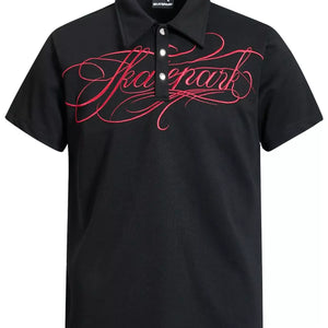 Scarlet Luxenk® Letter Embroidered Polo Shirt by Trendsi, close-up of embroidered lettering on a casual polo shirt.