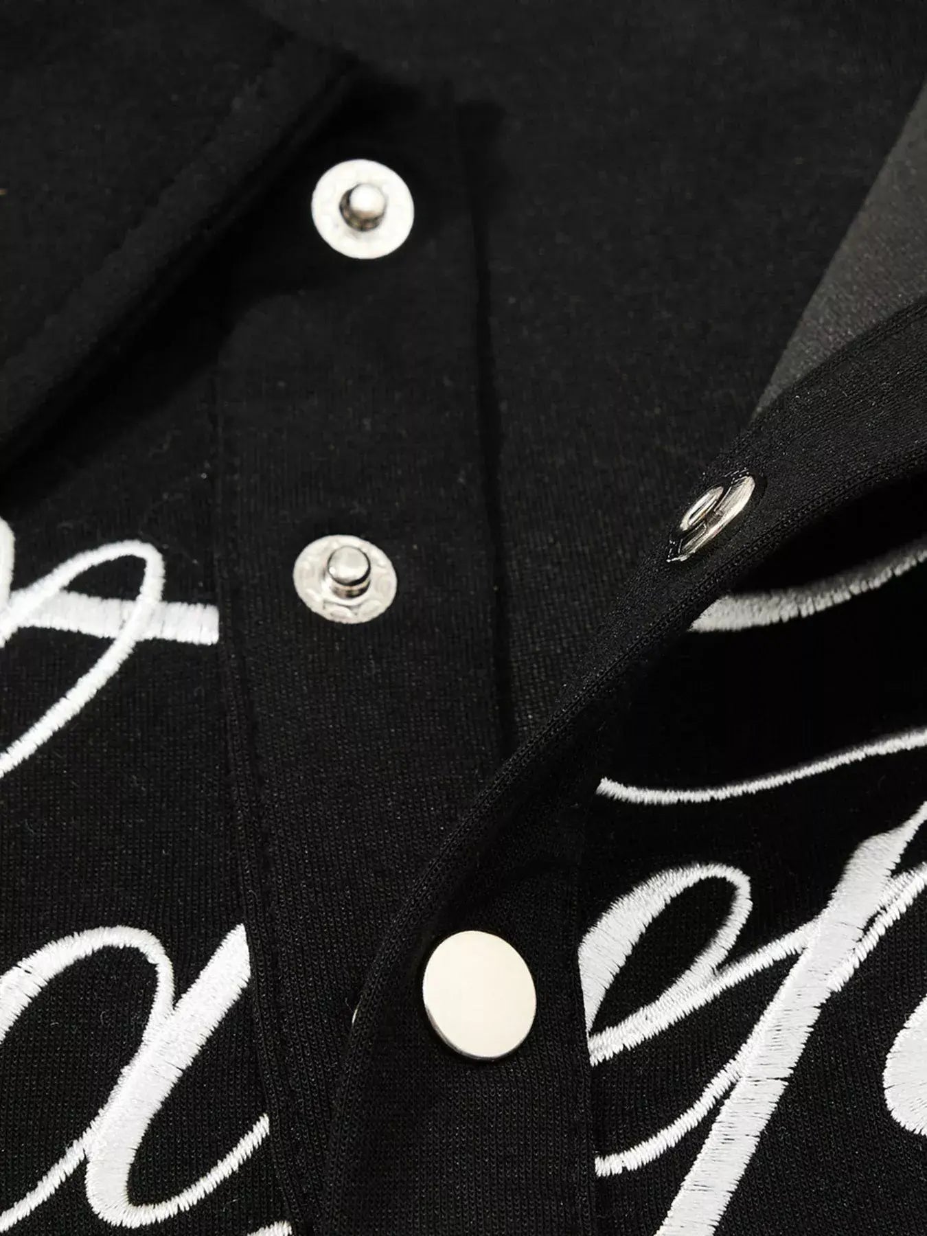 Scarlet LUXENK© "Letter Embroidered" polo shirt by Trendsi, featuring embroidered letter design and classic polo style.