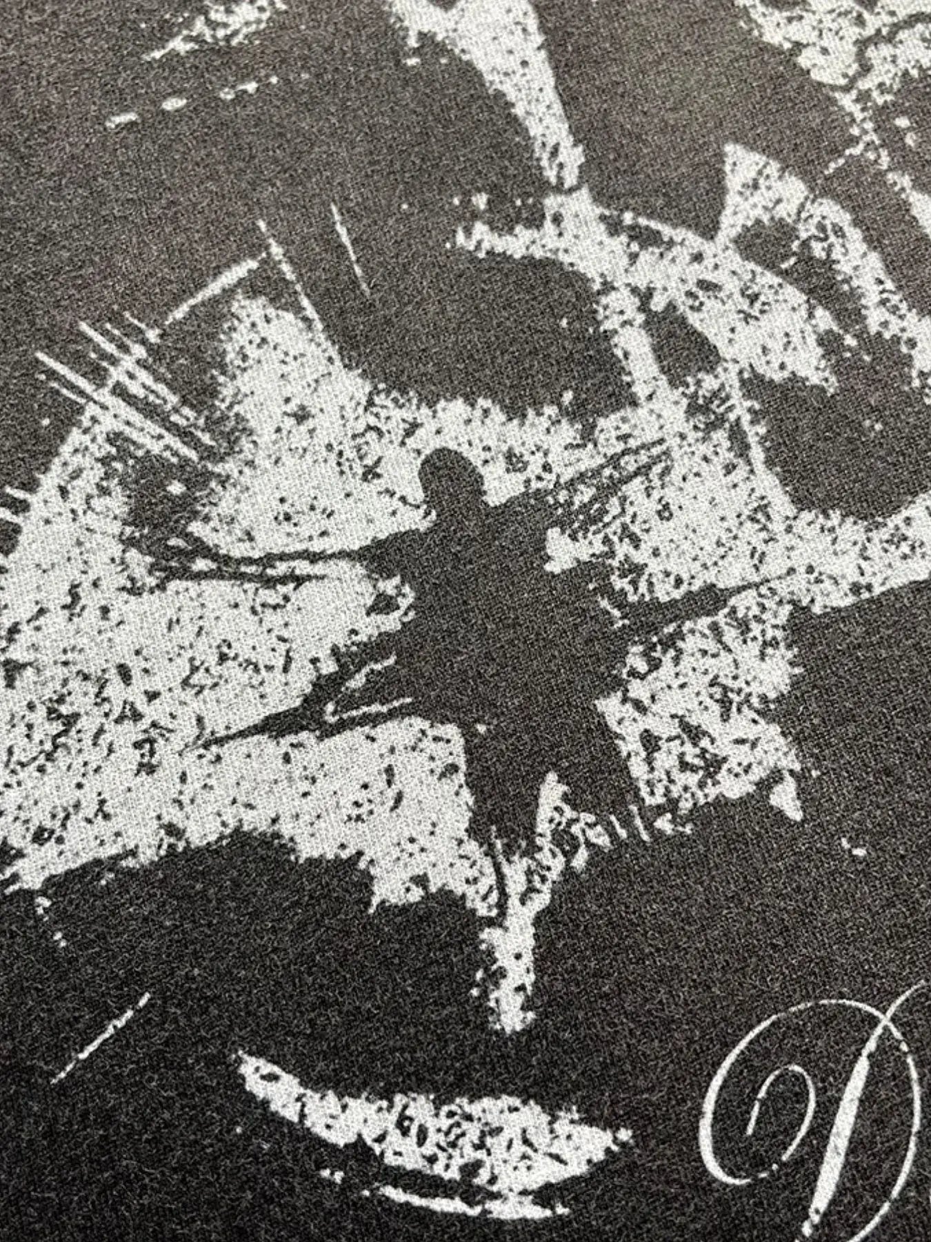 Black LUXENK Street Graphic T-shirt with spray dye design, featuring bold graphic artwork on the front.