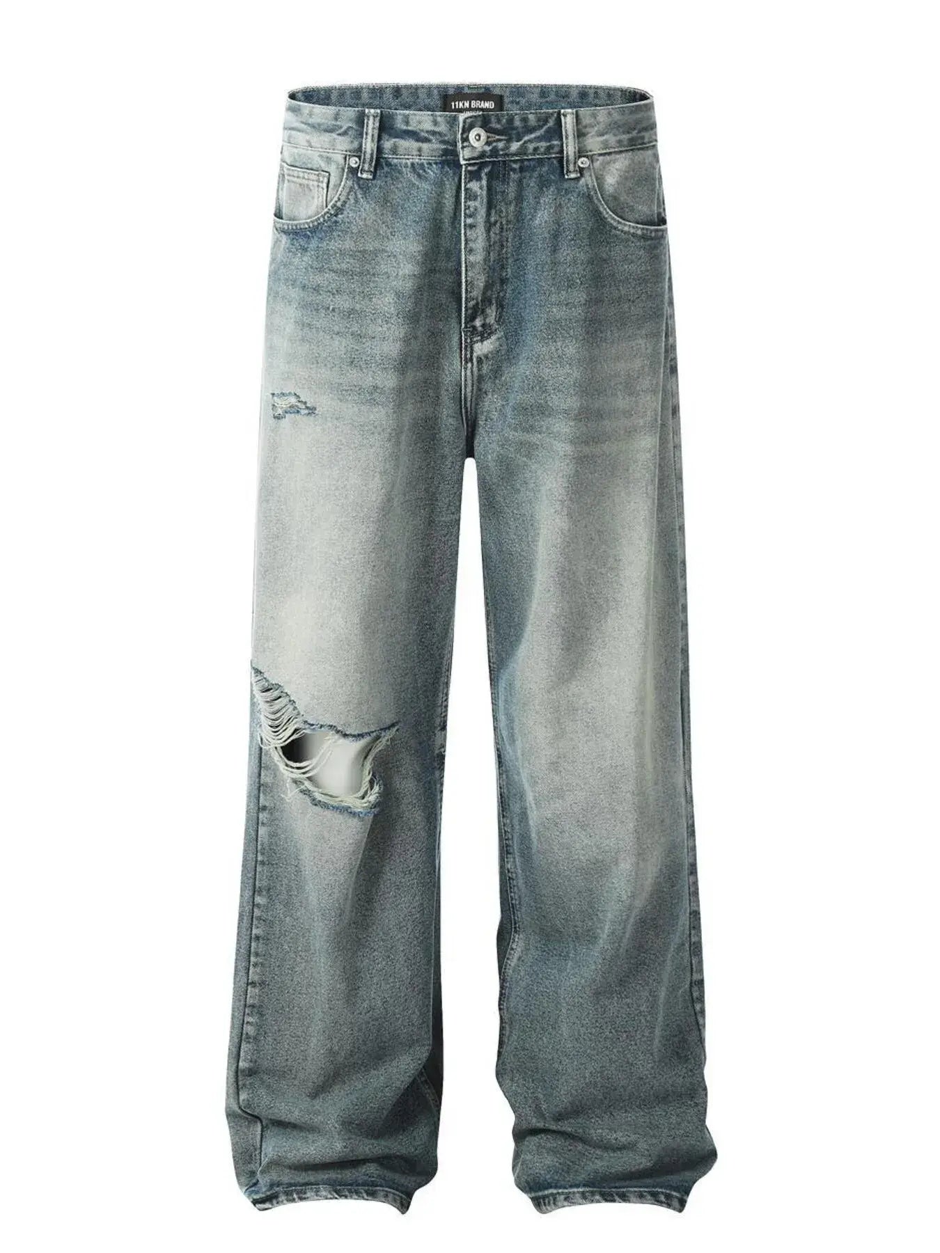Washed blue distressed vintage jeans by Luxenk© featuring a slim fit and faded details, shown on a model.