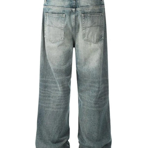 Light washed blue distressed vintage jeans by Luxenk, showing a relaxed fit and frayed hem details.