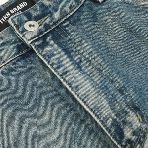 Washed blue distressed vintage jeans by Luxenk© featuring a slim fit and faded finish, styled with casual pockets and belt loops.