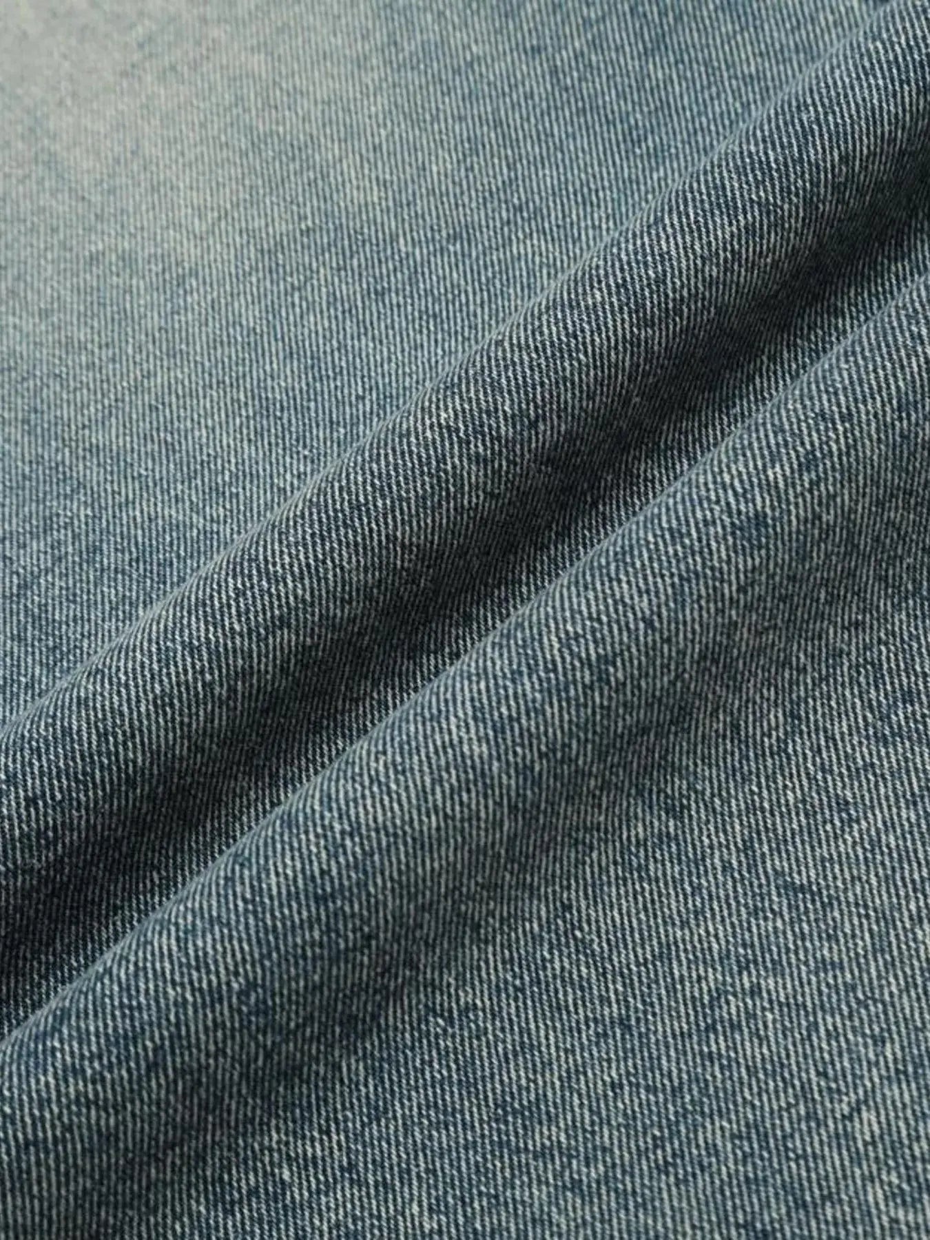 Light blue distressed vintage jeans from Luxenk© by Trendsi, featuring a worn-in washed look and classic denim style.