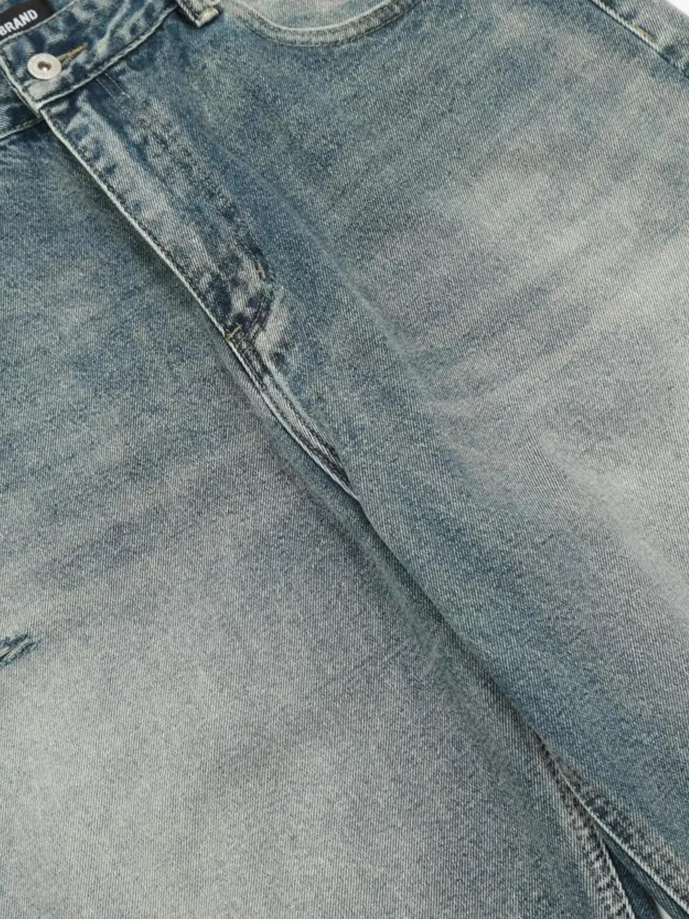 Washed blue distressed vintage jeans by LUXENK©, trendy slim-fit denim with frayed details and a casual, worn-in look.