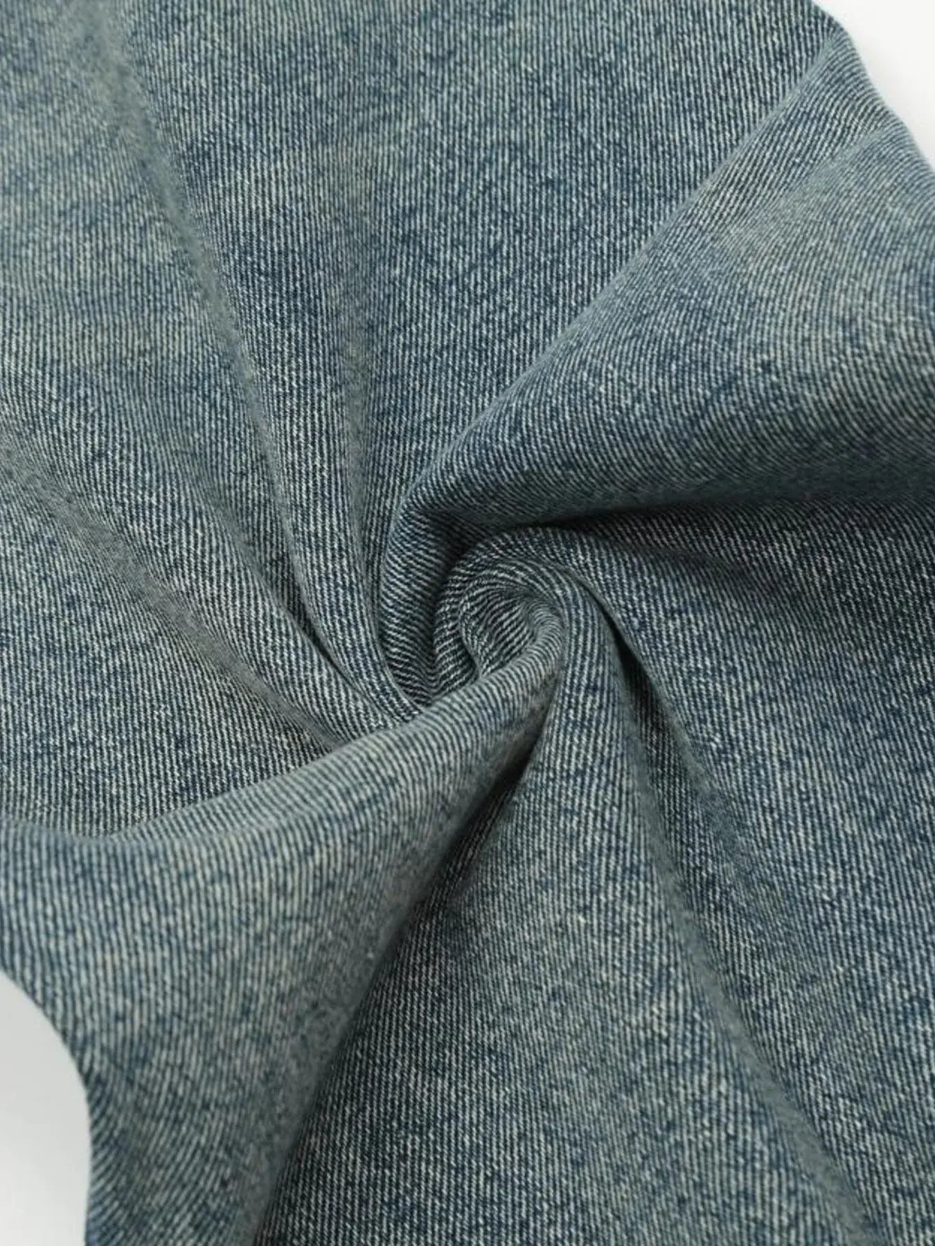 Light blue distressed vintage jeans by Luxenk from Trendsi, showing faded wash, frayed edges, and classic five-pocket style.