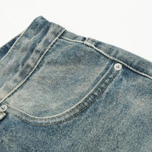Washed blue distressed vintage jeans by Luxenk© featuring a relaxed fit and faded denim, displayed on a white background.