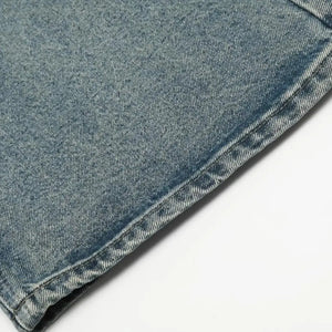 Washed blue distressed vintage LUXENK© jeans by Trendsi, showcasing a fitted skinny style with intentional fading and rips.