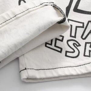 White Luxenk© "Graffiti Slim" jeans by Trendsi, showing the slim-fit design and trendy graffiti-inspired detailing.
