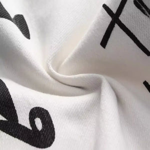 White Luxenk© Graffiti Slim Jeans by Trendsi featuring a slim fit and stylish design, shown on a mannequin.